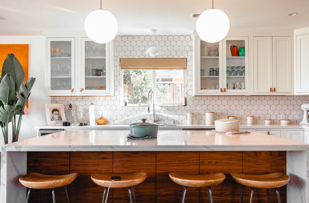 white countertops in an open kitchen